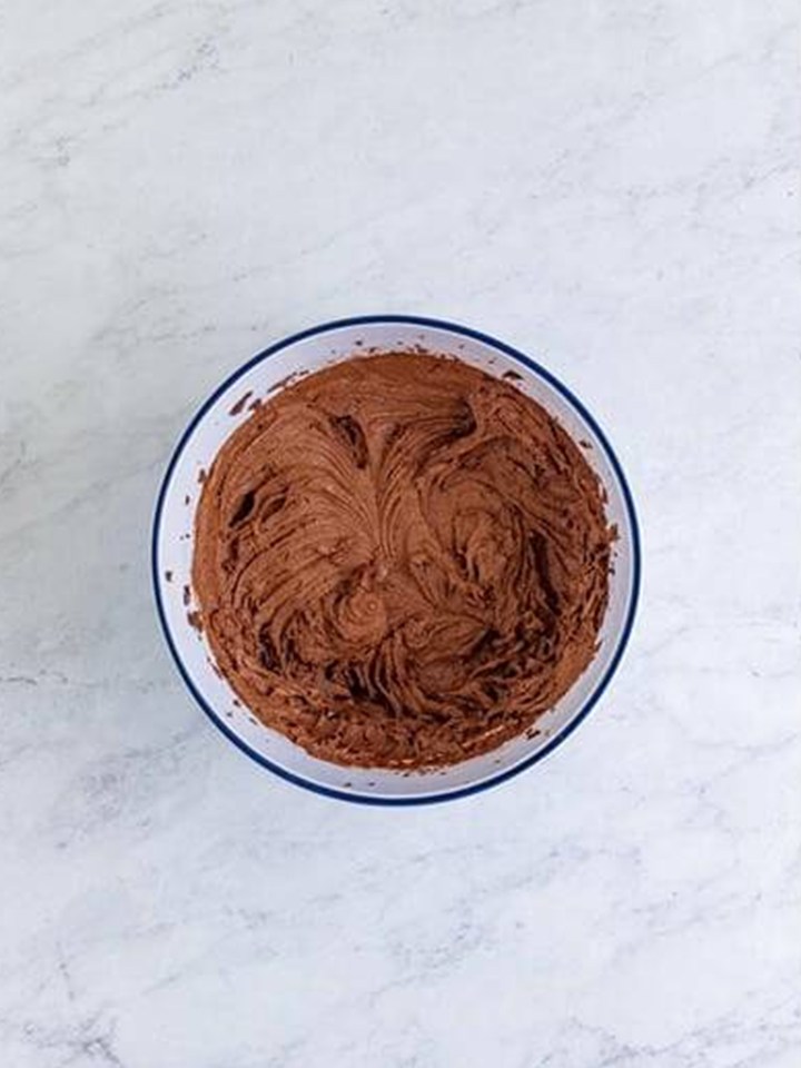 Firm Baileys ganache whipped light and fluffy in a bowl.