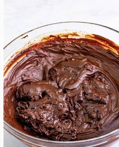 The baileys ganache cooled and thickened before whipping.