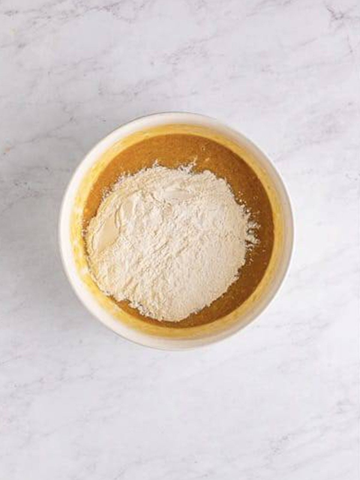 Flour mixture added to the wet ingredients for Banana Blondies batter.