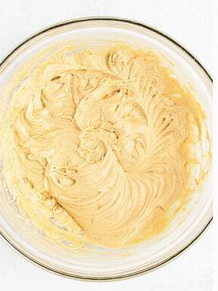 Eggs and vanilla beaten into the Biscoff cupcake batter.