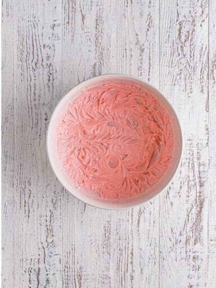 Cream cheese and cherry juice mixed smooth and pink for brownie truffles.