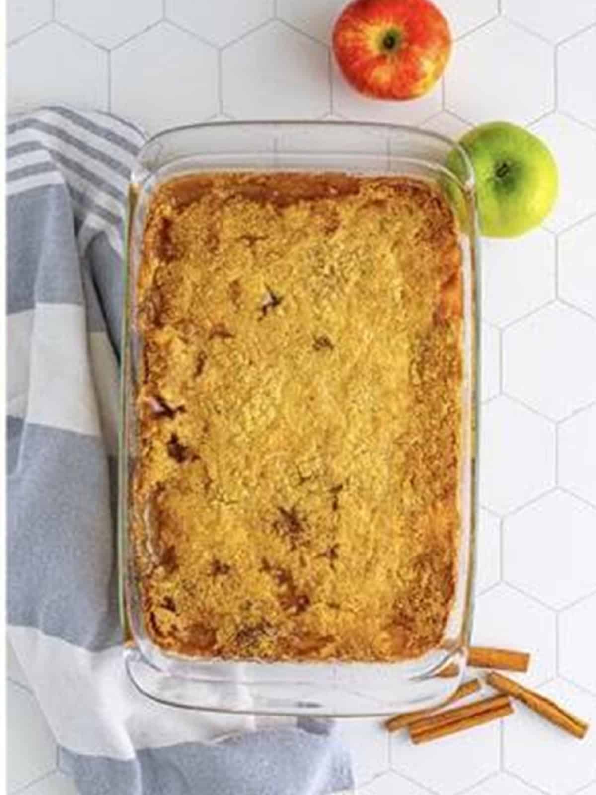 Golden baked caramel apple dump cake bubbling in the baking dish.