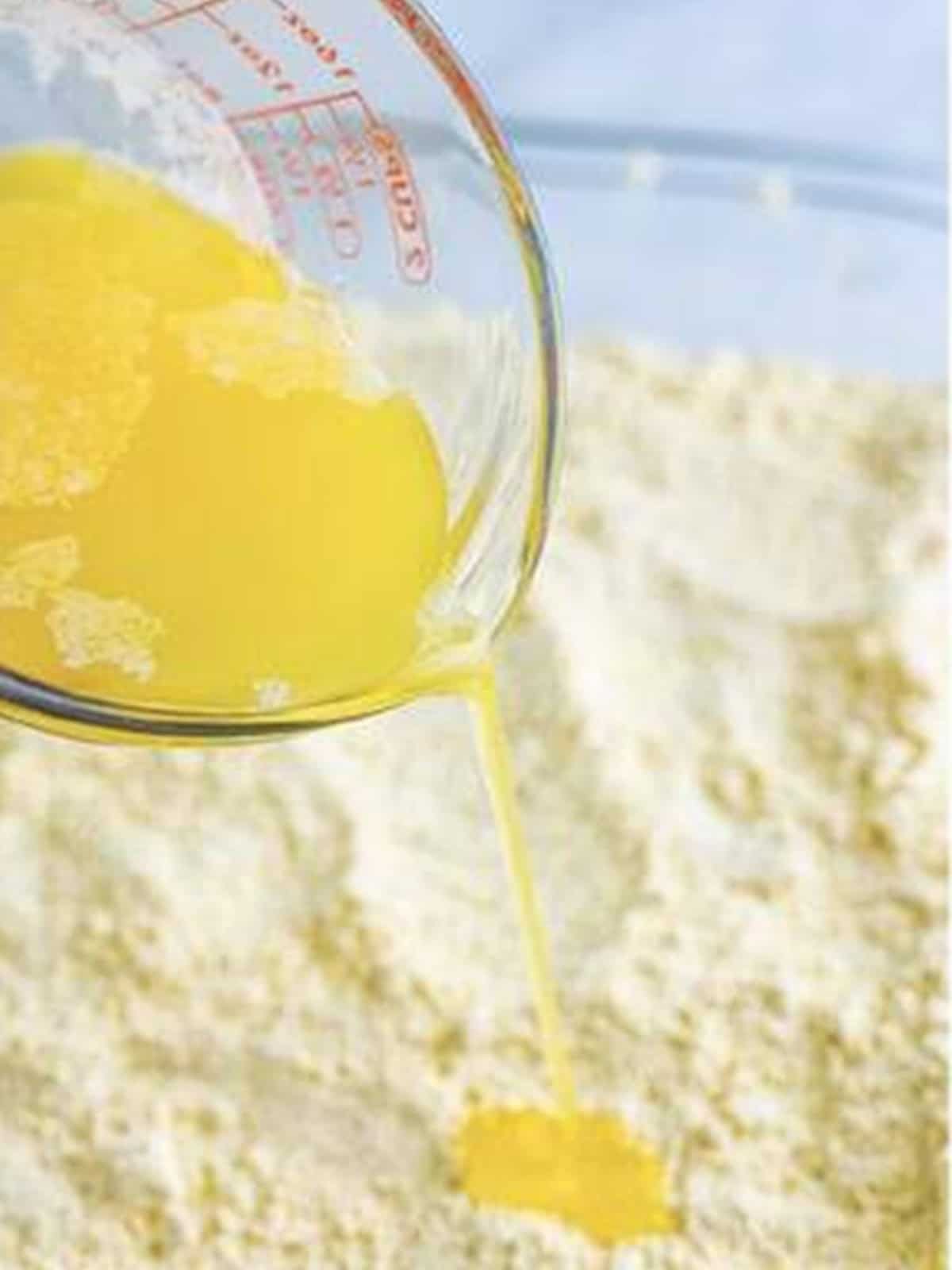 Melted butter poured over the cake mix for caramel apple dump cake.