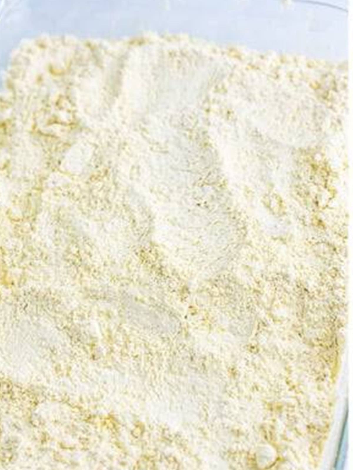 Dry yellow cake mix sprinkled evenly over the apple and caramel layer.