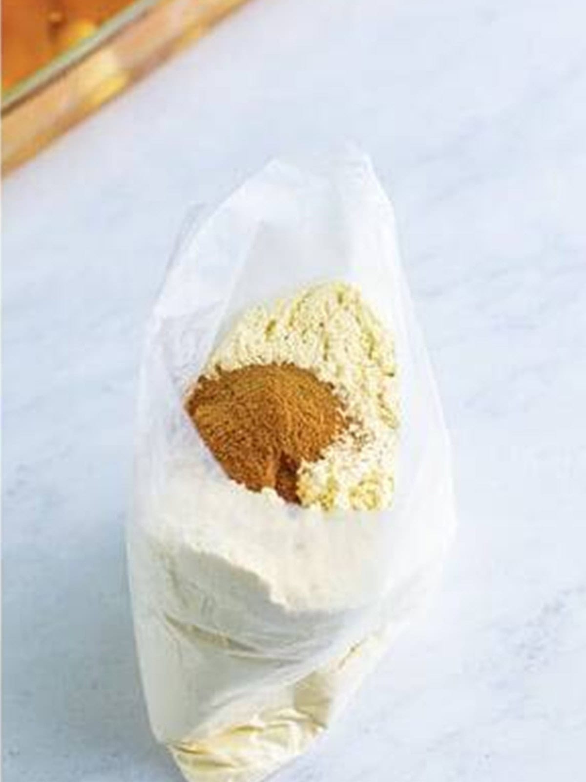 Cinnamon stirred into the yellow cake mix in the bag for caramel apple dump cake.