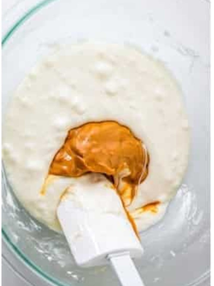 Creamy peanut butter added to the melted marshmallow mixture for chex bars.