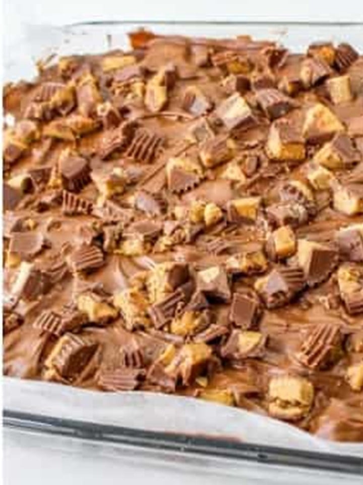 Chopped mini Reese's cups pressed into the melted chocolate topping on the chex bars.