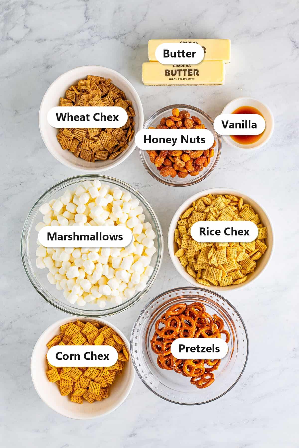 Labeled ingredients for Chex Marshmallow Treats including rice, corn, and wheat Chex, marshmallows, pretzels, honey nuts, butter, and vanilla.