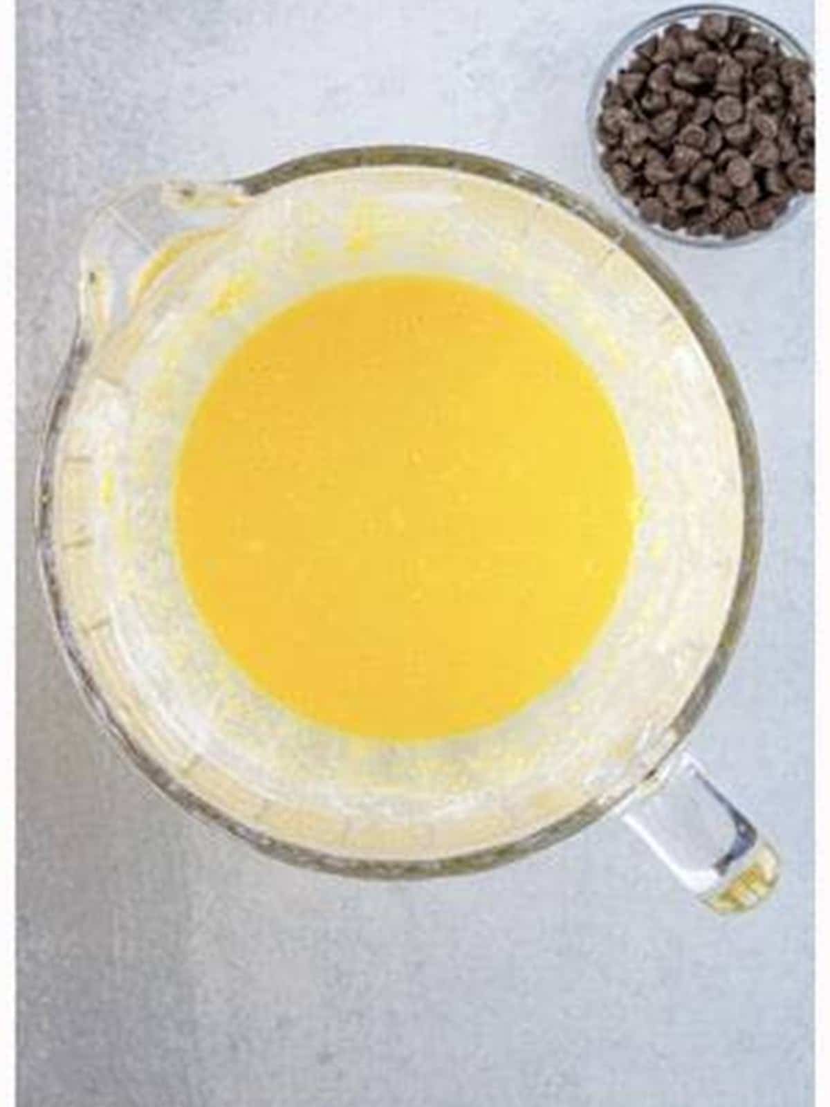 Eggs, vanilla, sour cream, and coffee creamer mixed until creamy for Chocolate Chip Coffee Cake.