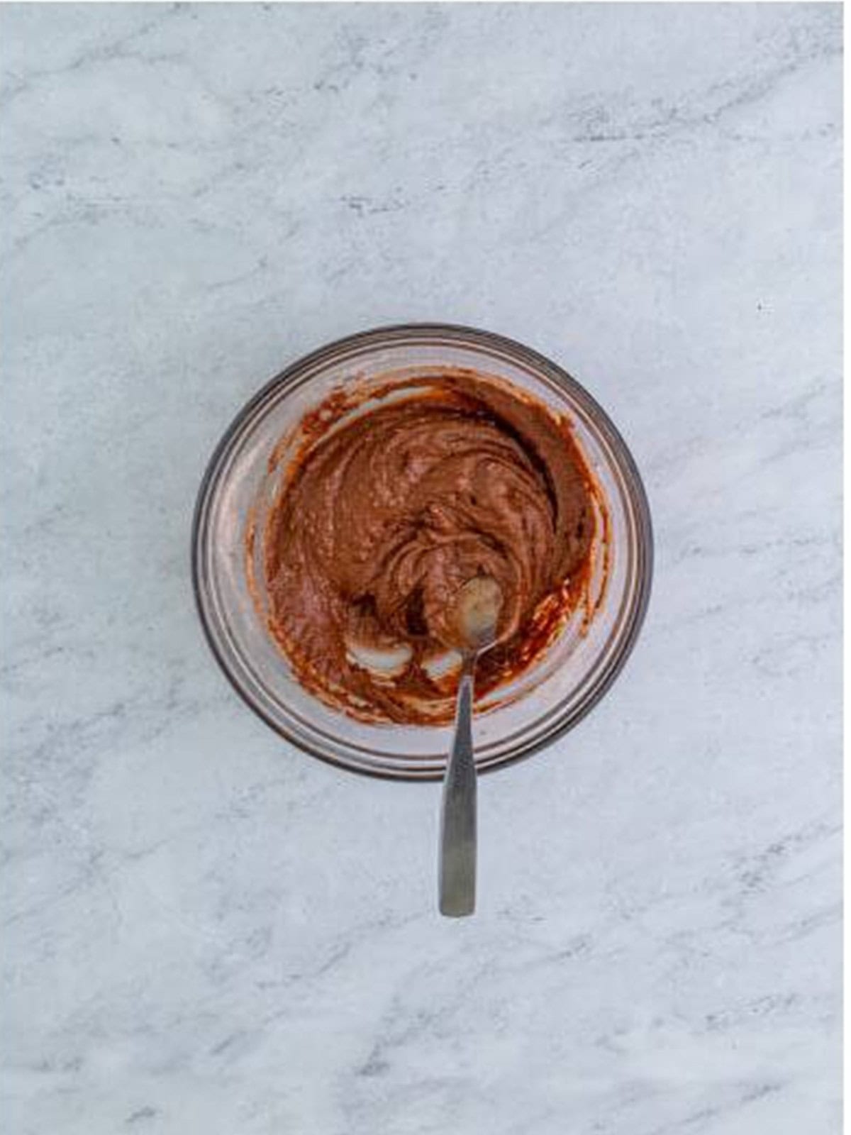 The wet ingredients stirred into the dry until no dry patches remain.