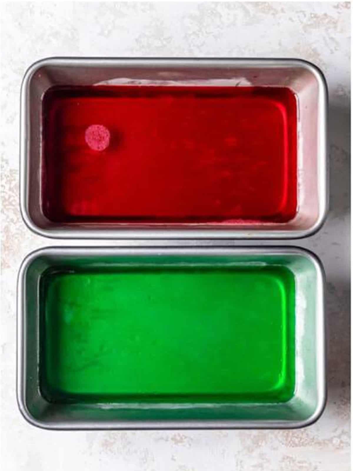 Red and green jello chilled and set firm in loaf pans.