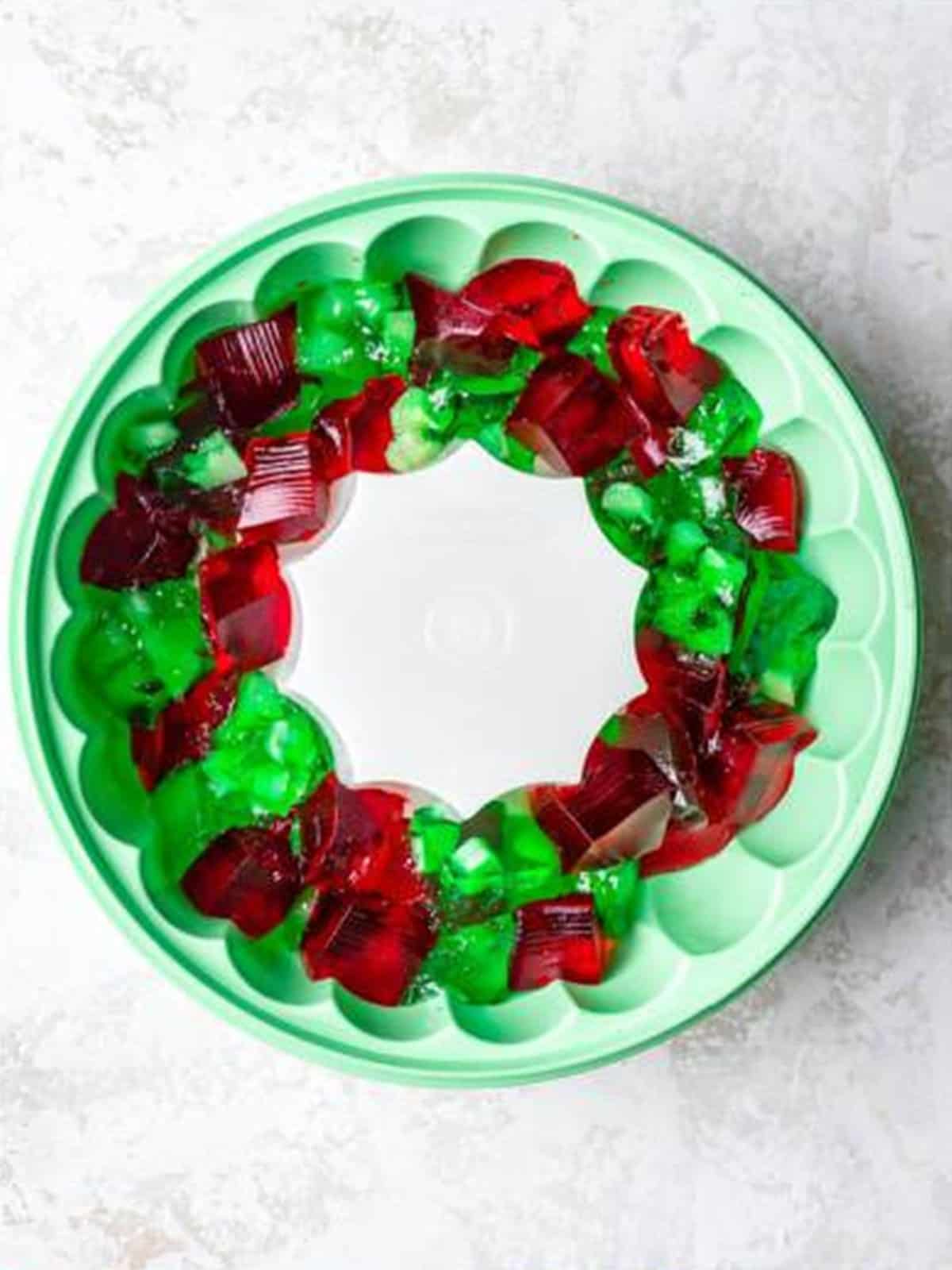 Cubed red and green jello layered in the bottom of a ring mold.