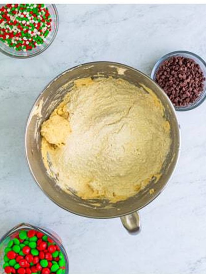 Eggs and vanilla mixed into the creamed butter for christmas sandwich cookie dough.