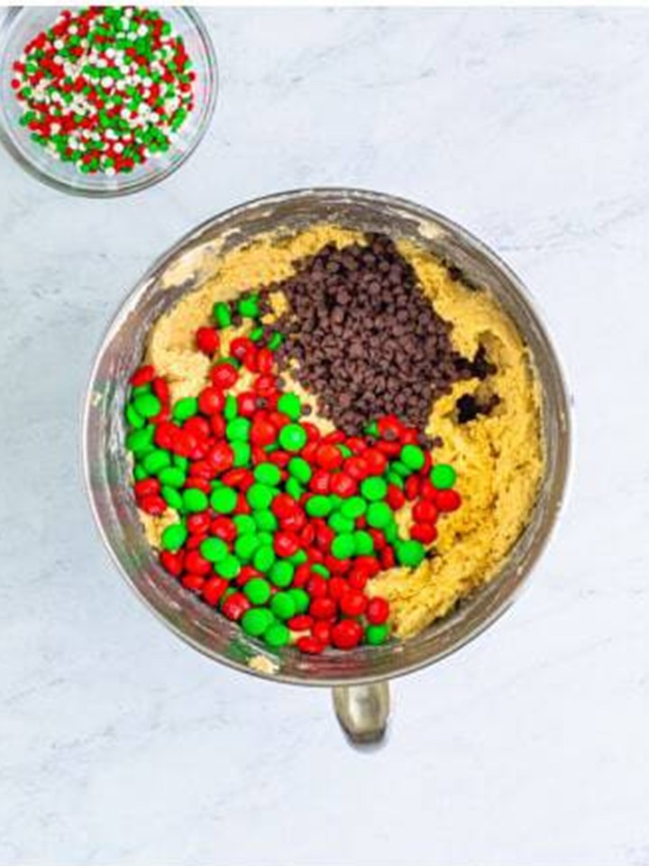 Holiday M&Ms and mini chocolate chips added to the cookie dough.