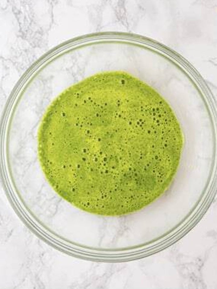 Fresh spinach and milk blended into a smooth bright green mixture.