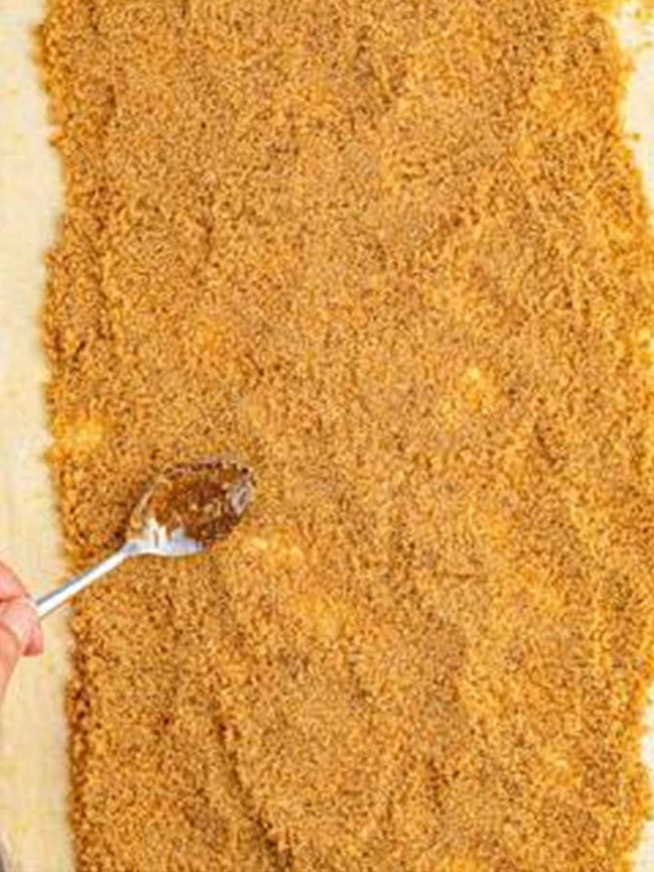 Brown sugar cinnamon filling spread evenly over the rolled out Cinnamon Rolls dough.