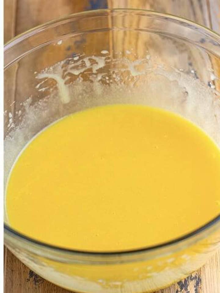 Eggs and coconut and vanilla extracts whisked into the sugar mixture until smooth.