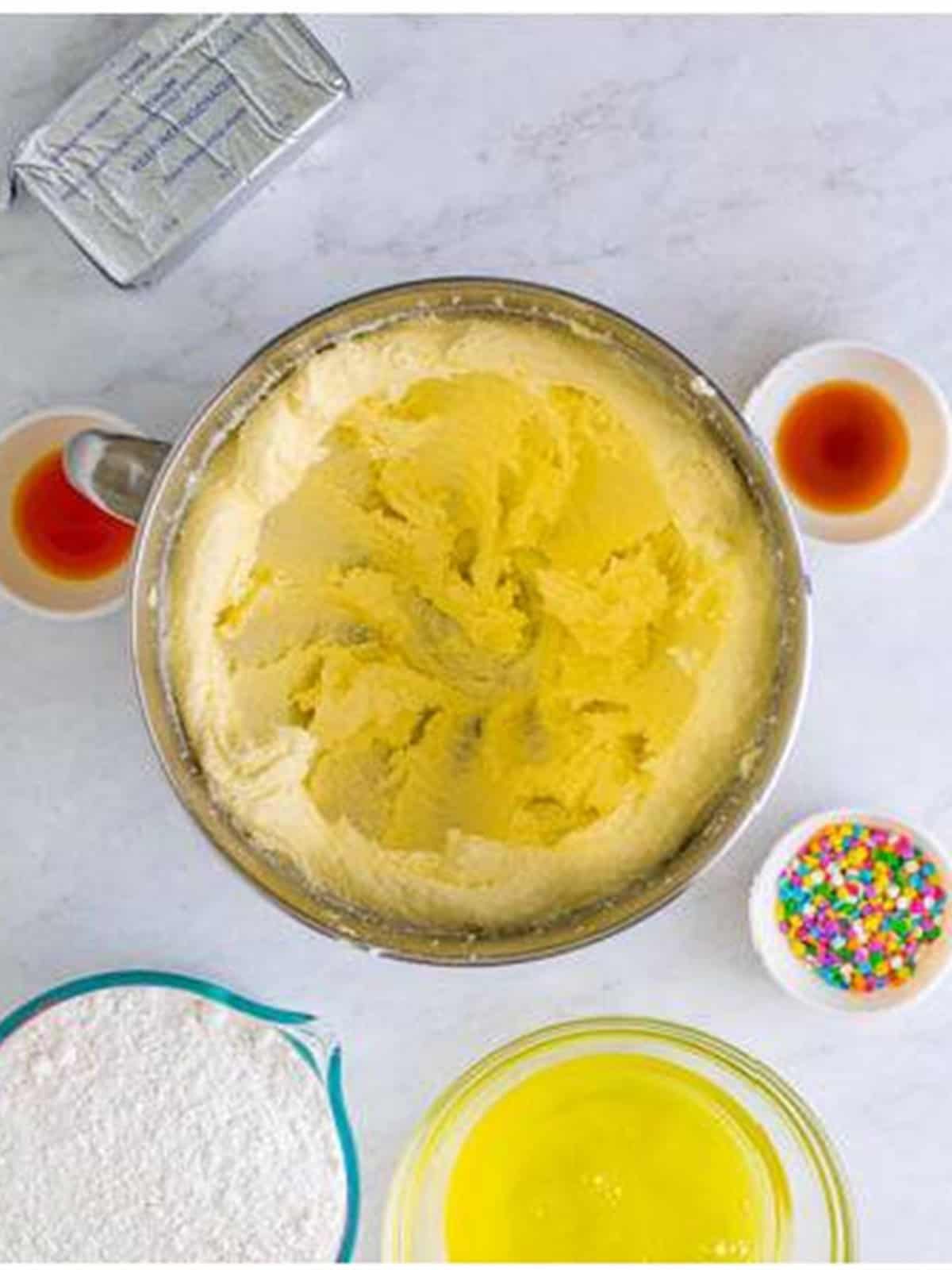 Butter and sugar creamed together until light and fluffy in a stand mixer for confetti cake cookies.