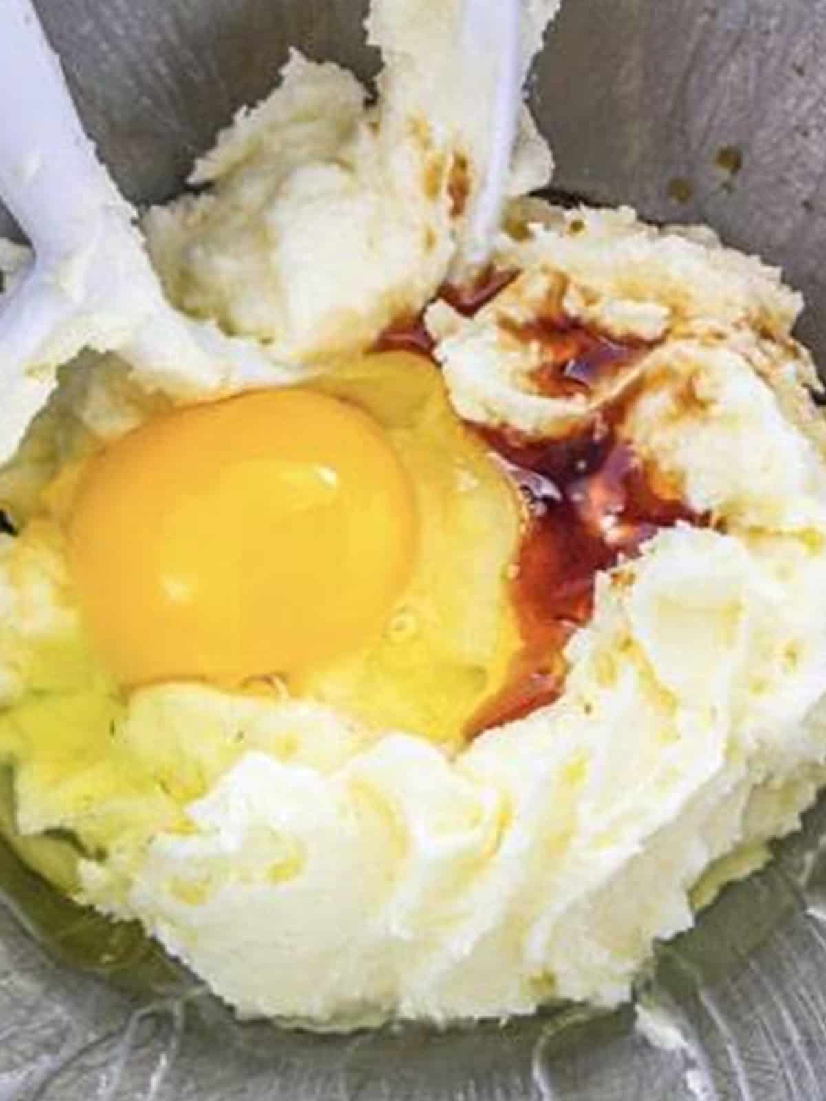 Egg, milk, and vanilla extract added to the creamed butter mixture.