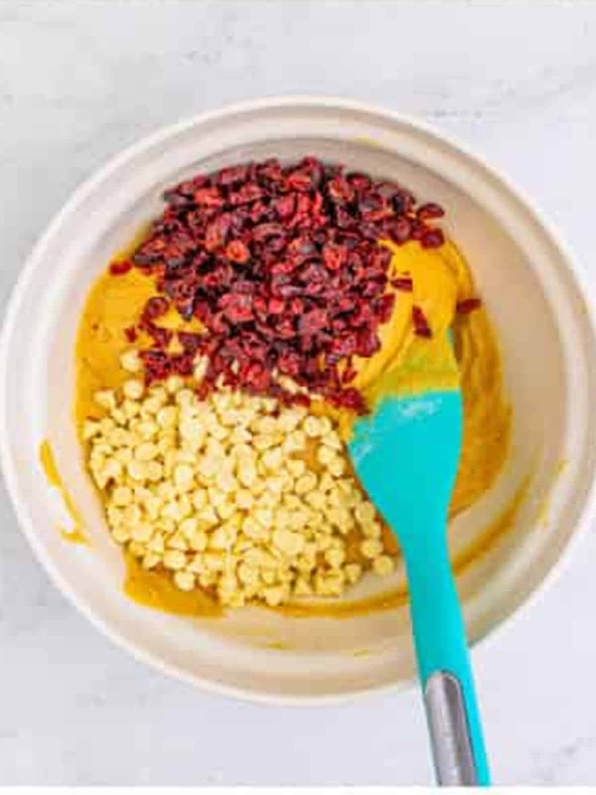 Dried cranberries and white chocolate chips added to blondie batter.