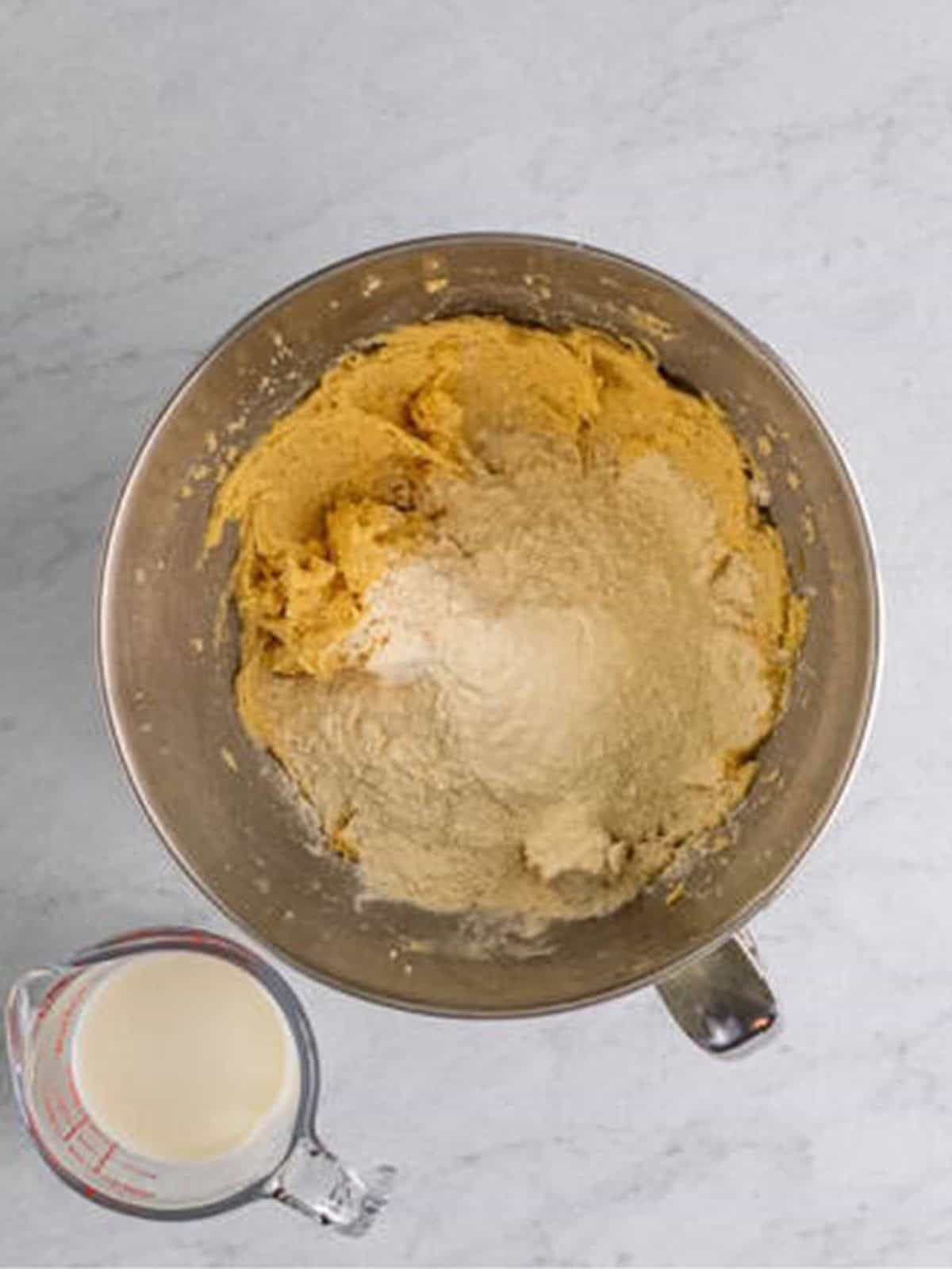 Flour and milk added in turns to the Cranberry Coffee Cake batter.