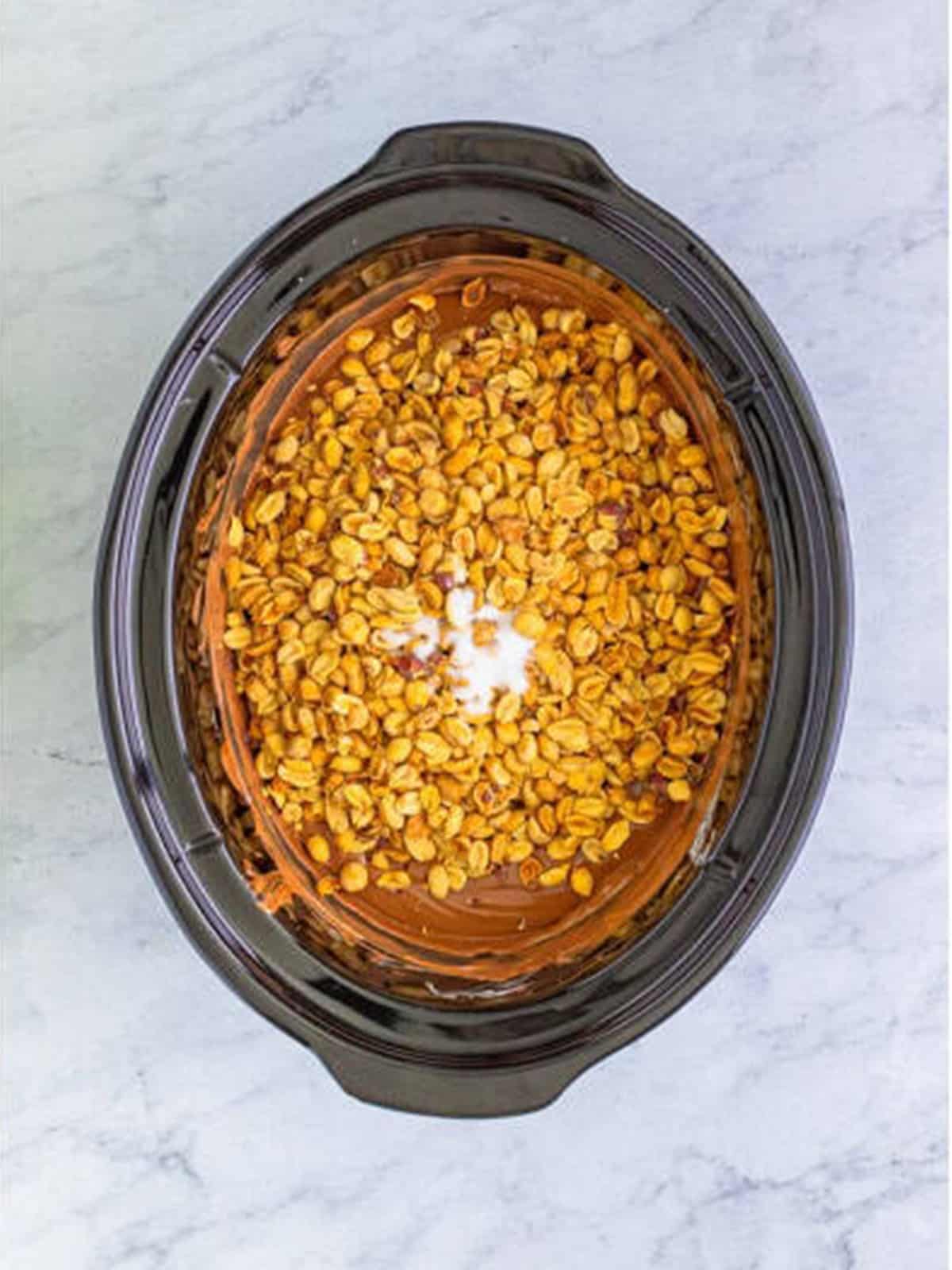 Dry roasted peanuts and sea salt added on top of the melted chocolate
