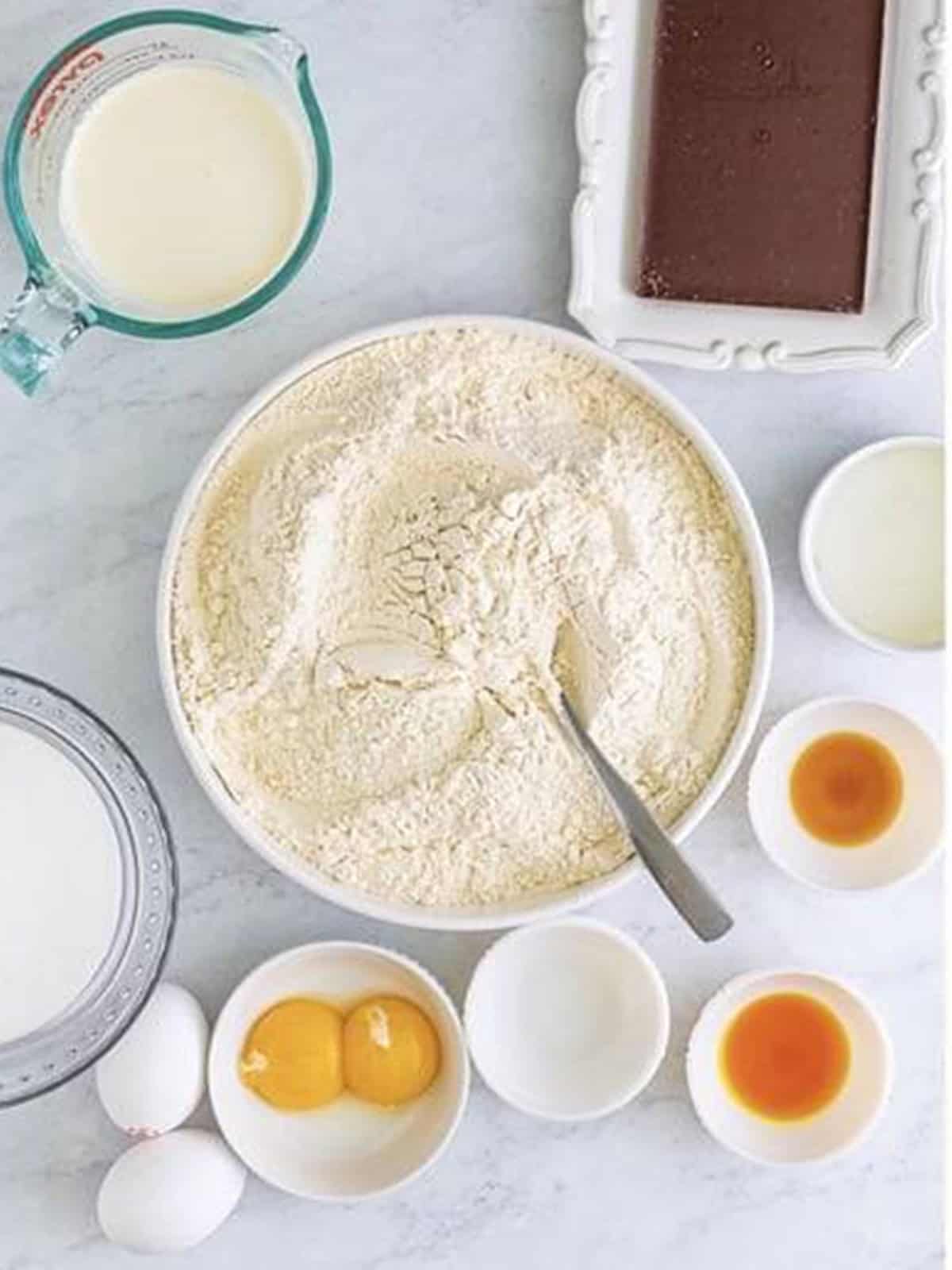 Flour, baking powder, and salt stirred together for Crumbl Chocolate Cupcake Cookies.