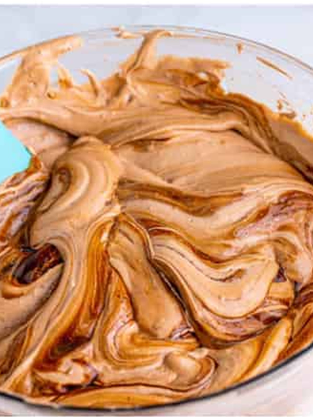 Swirling chocolate syrup into the pudding mixture for a marbled look.