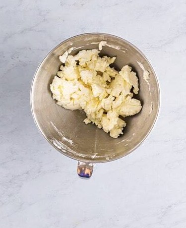 Cream of coconut and vanilla stirred into the frosting mixture.