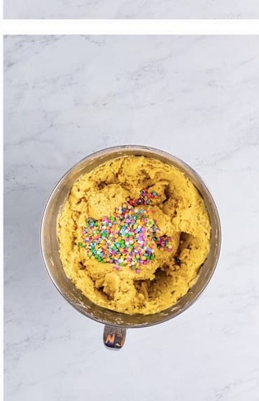 Colorful confetti sprinkles stirred into the Easter Cookie Bars batter.