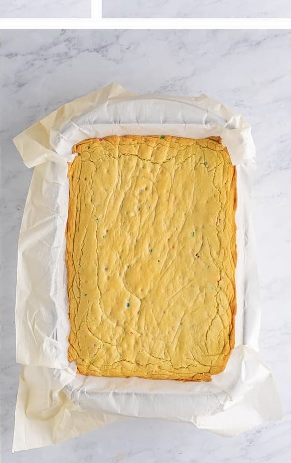 Baked Easter Cookie Bars cooling in the pan before frosting.