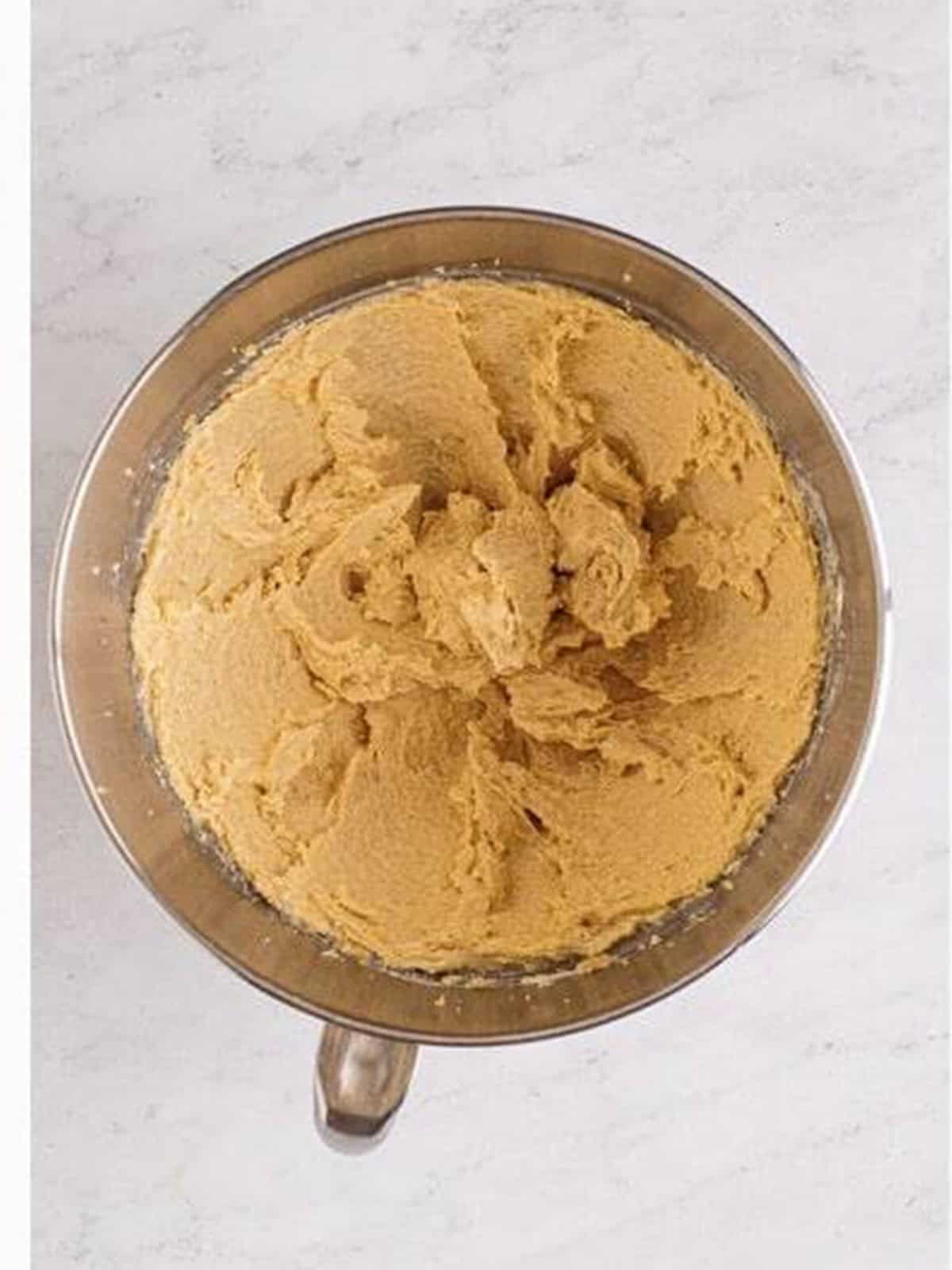 Butter and sugars creamed together in a mixing bowl for edible cookie dough.