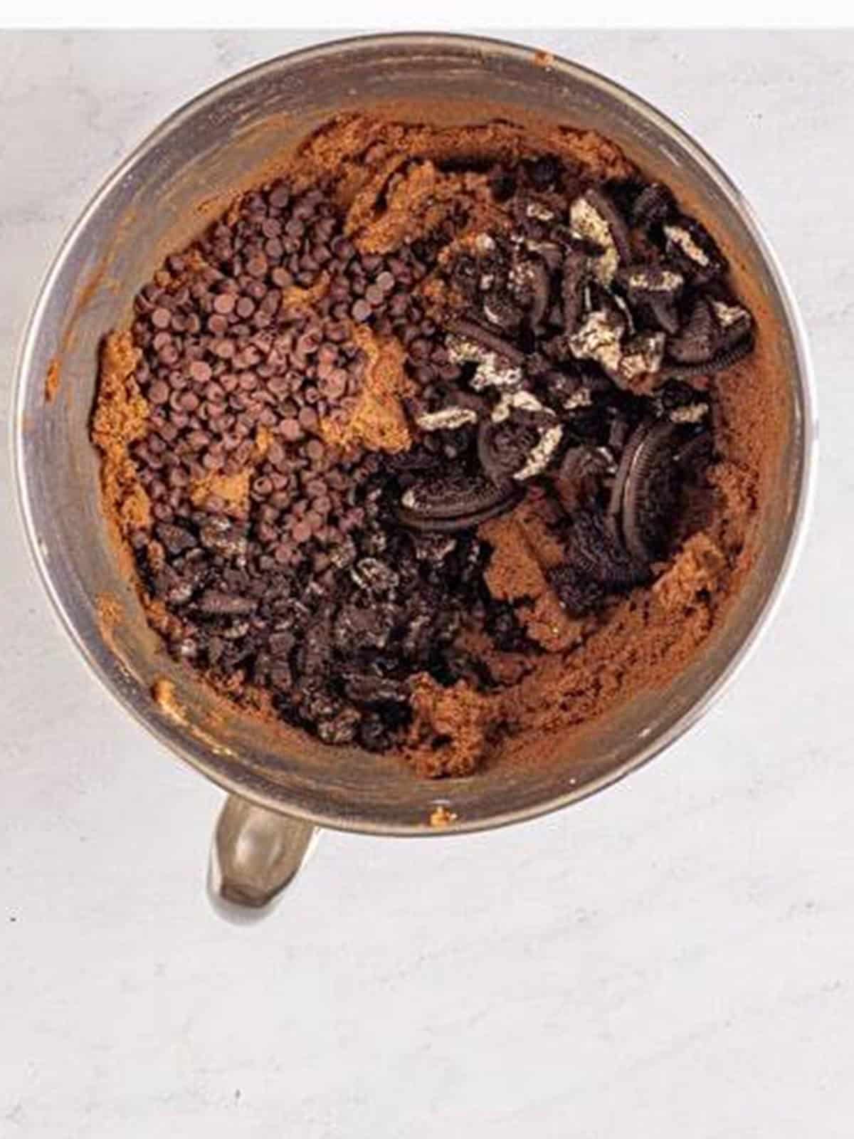 Chocolate chips and crushed Oreos added to chocolate edible cookie dough.