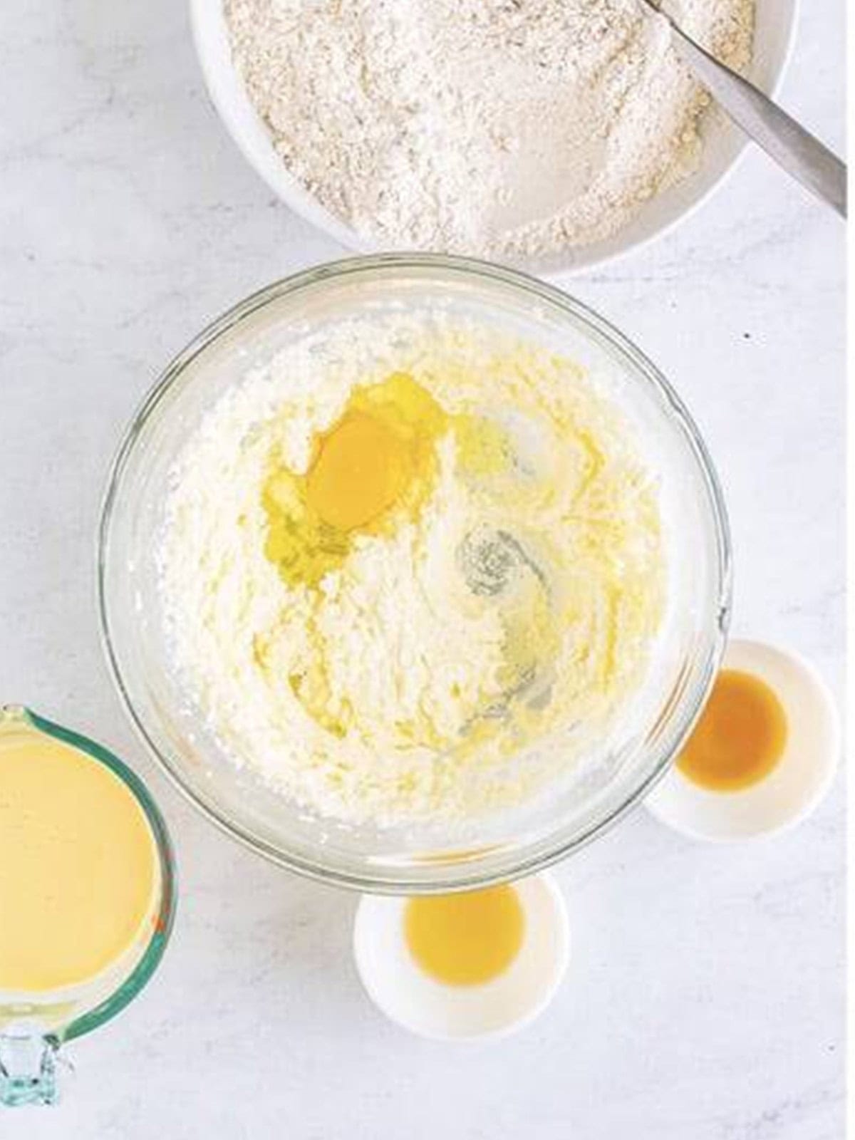 Egg added to the creamed butter and sugar for eggnog bread batter.