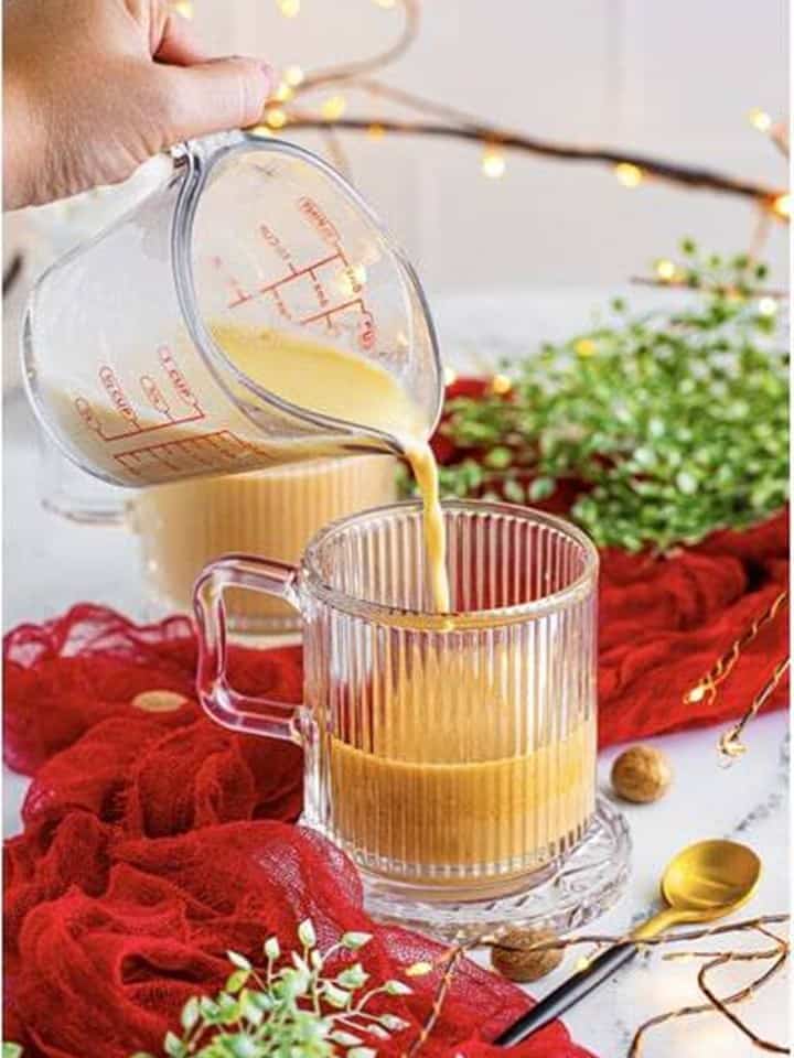 Adding warm eggnog to the coffee for an Eggnog Latte.