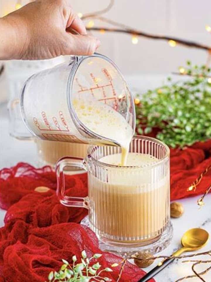 Pouring frothed eggnog on top of the Eggnog Latte.
