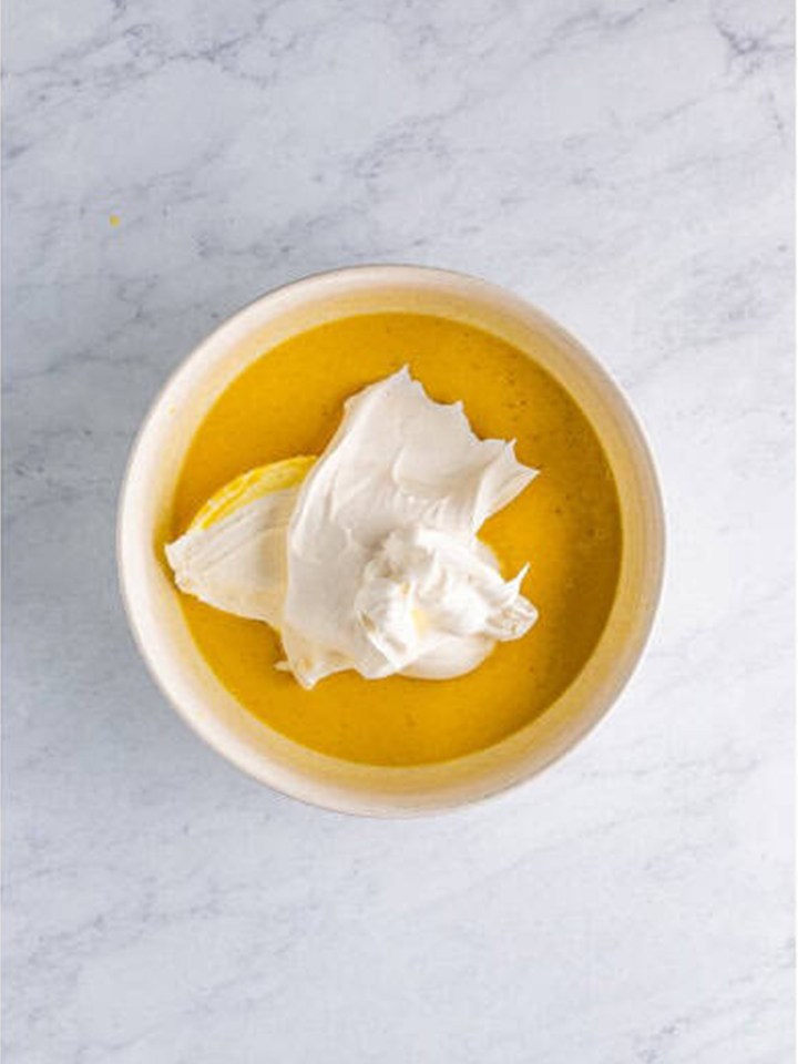 Whipped topping added to the eggnog pudding mixture before folding.
