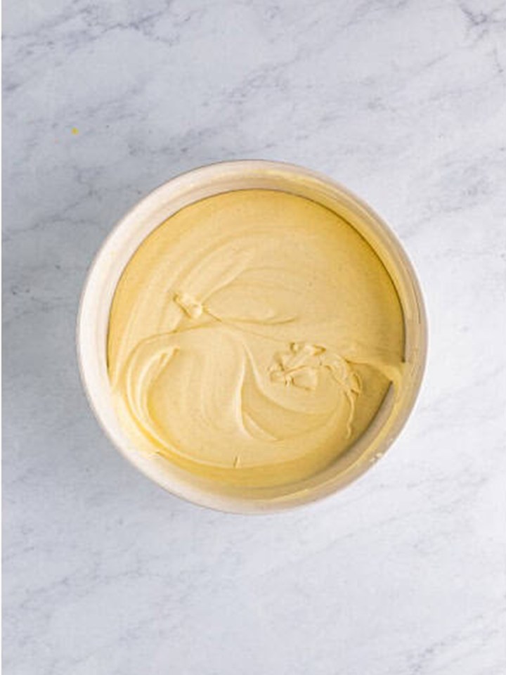 The whipped topping folded fully into the eggnog pudding for the shots.
