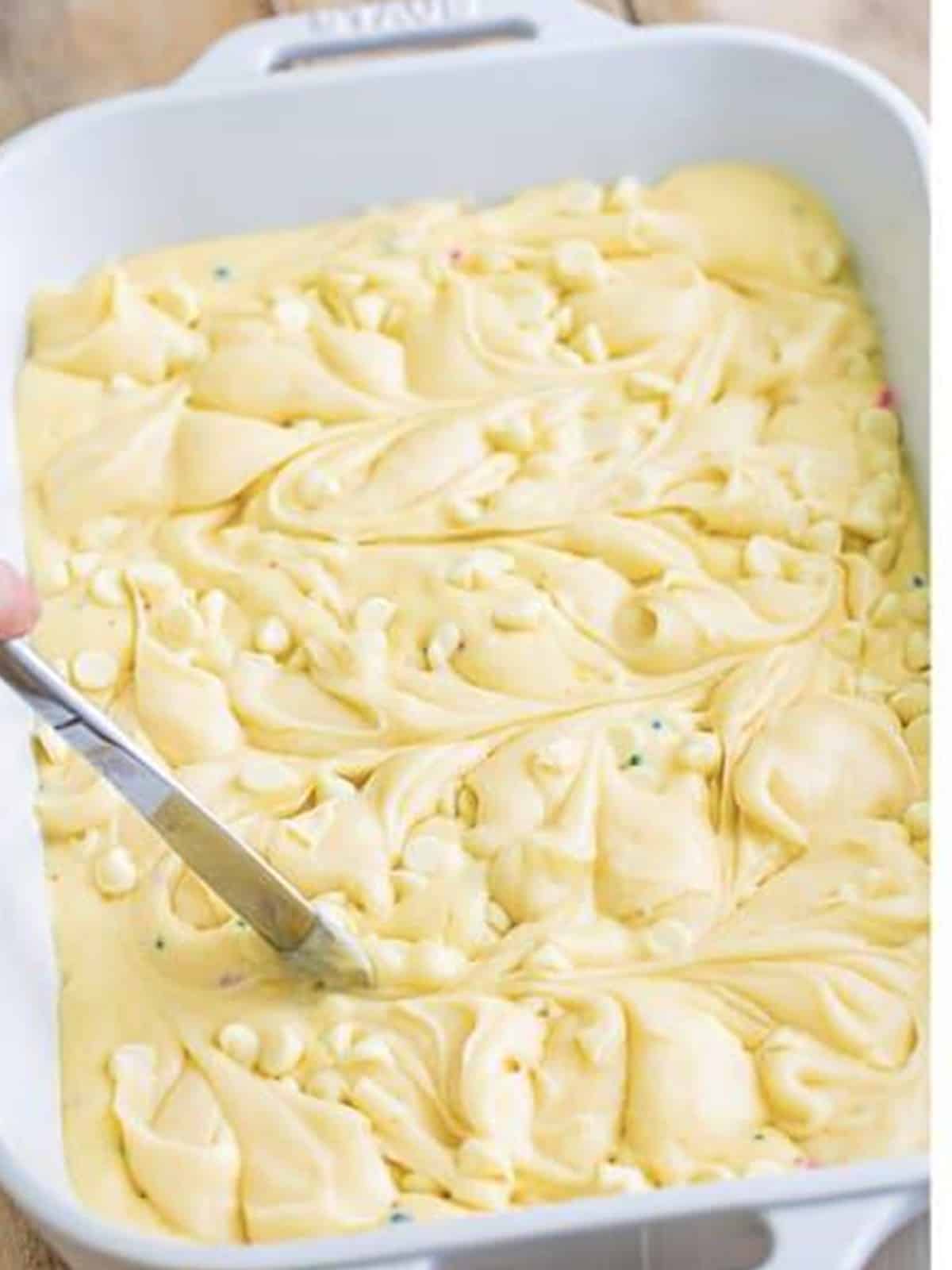 Dollops of cream cheese mixture swirled into the funfetti cake batter.