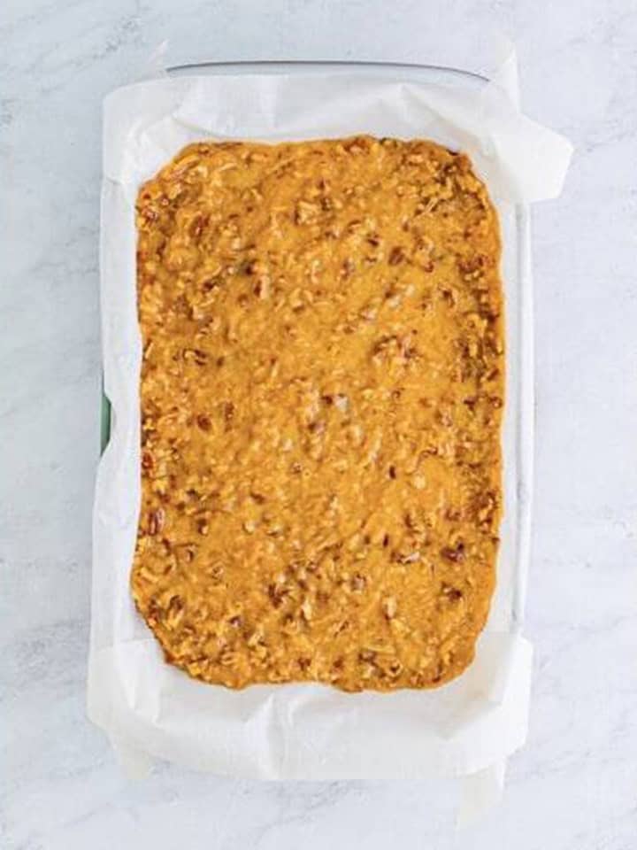 Coconut pecan topping spread over the cooled German chocolate brownies.