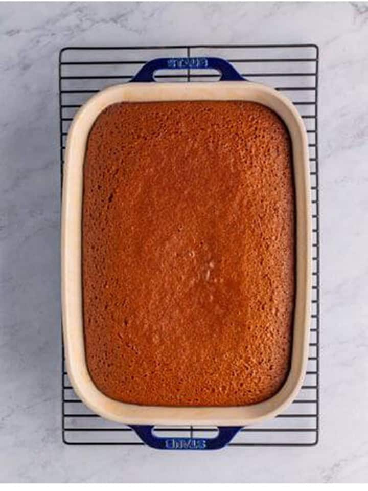 Baked Gingerbread Cake cooling in the baking dish on a wire rack.