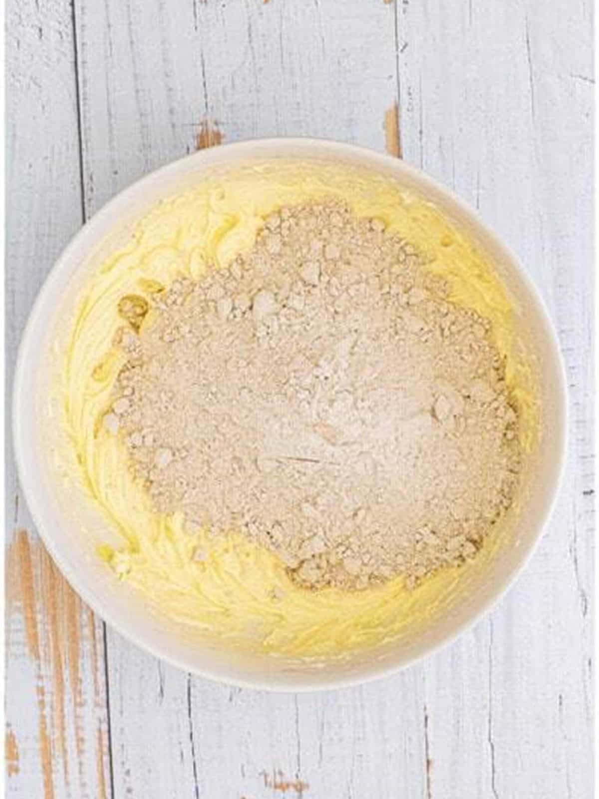 Spice cake mix added to the creamed cream cheese and butter base for gooey butter cookies.
