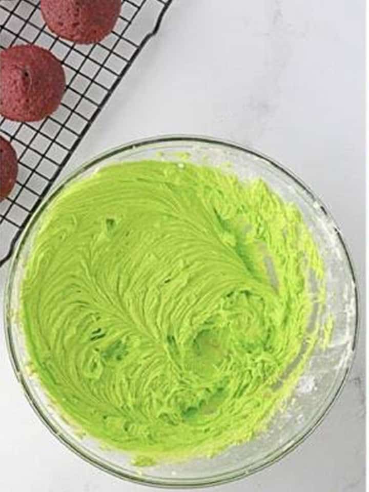 Buttercream frosting colored bright grinch green with neon green gel coloring.