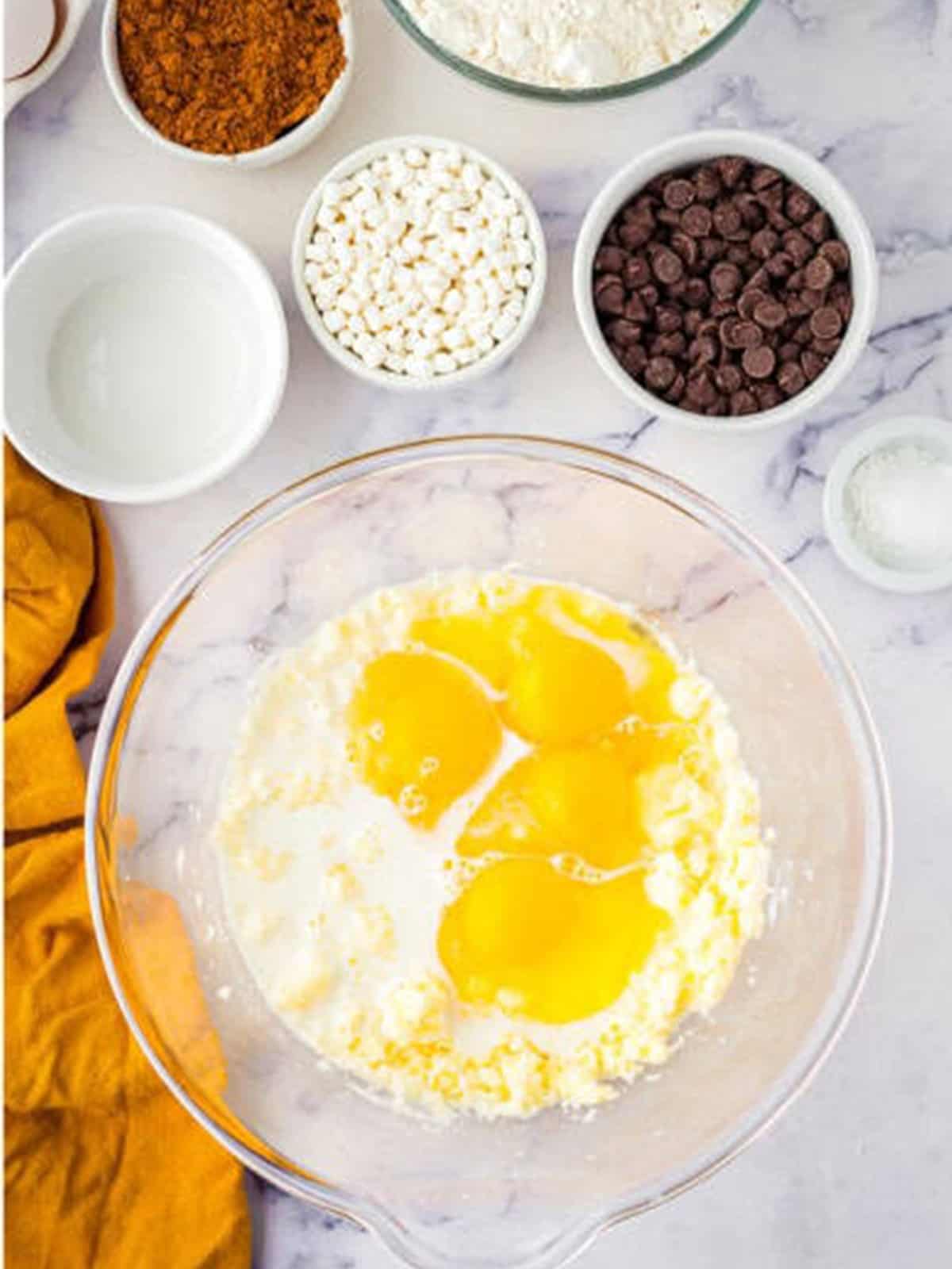 Eggs and milk whisked into the creamed butter and sugar.