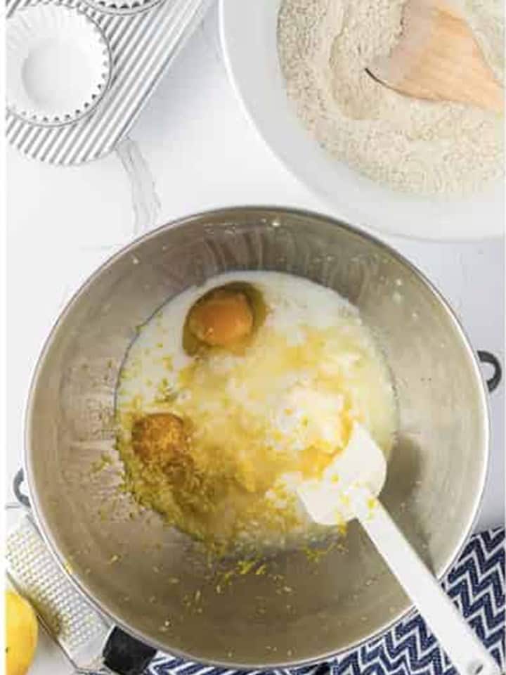 Eggs, buttermilk, lemon juice, and zest added to creamed butter and sugar in the mixer bowl.