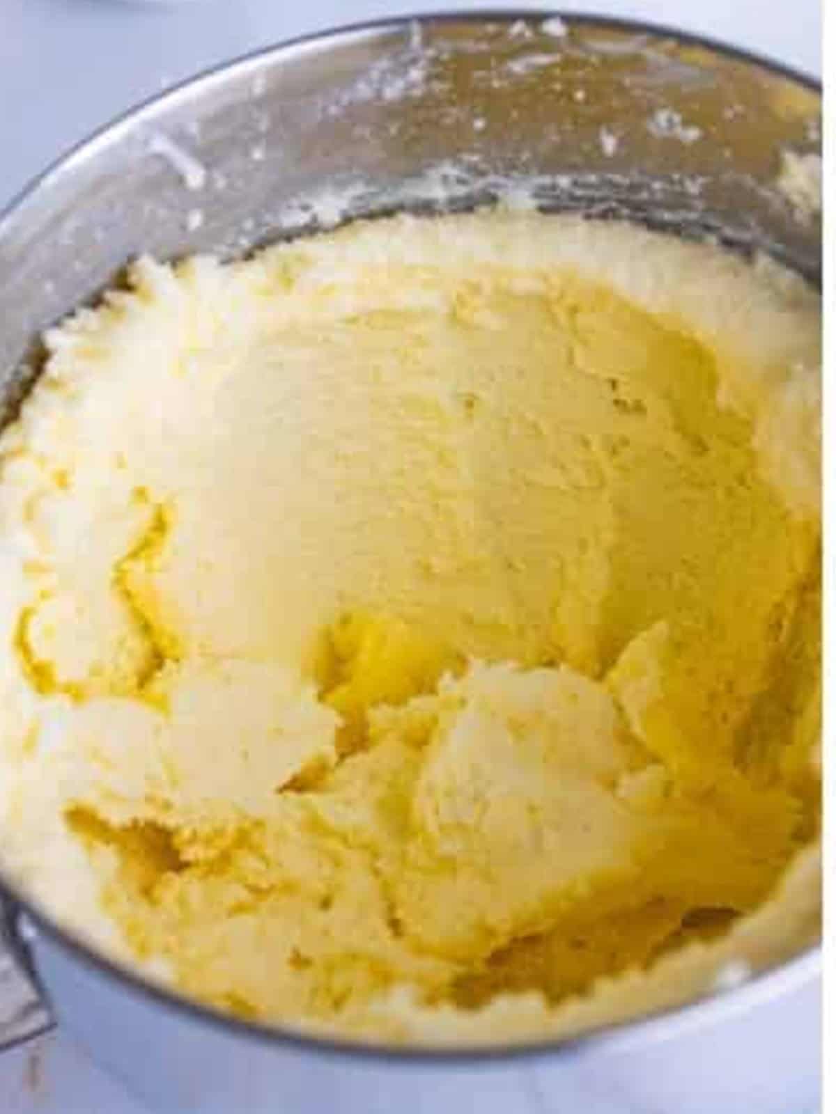 Creaming softened butter and granulated sugar in a stand mixer for Lemon Blueberry Pound Cake.