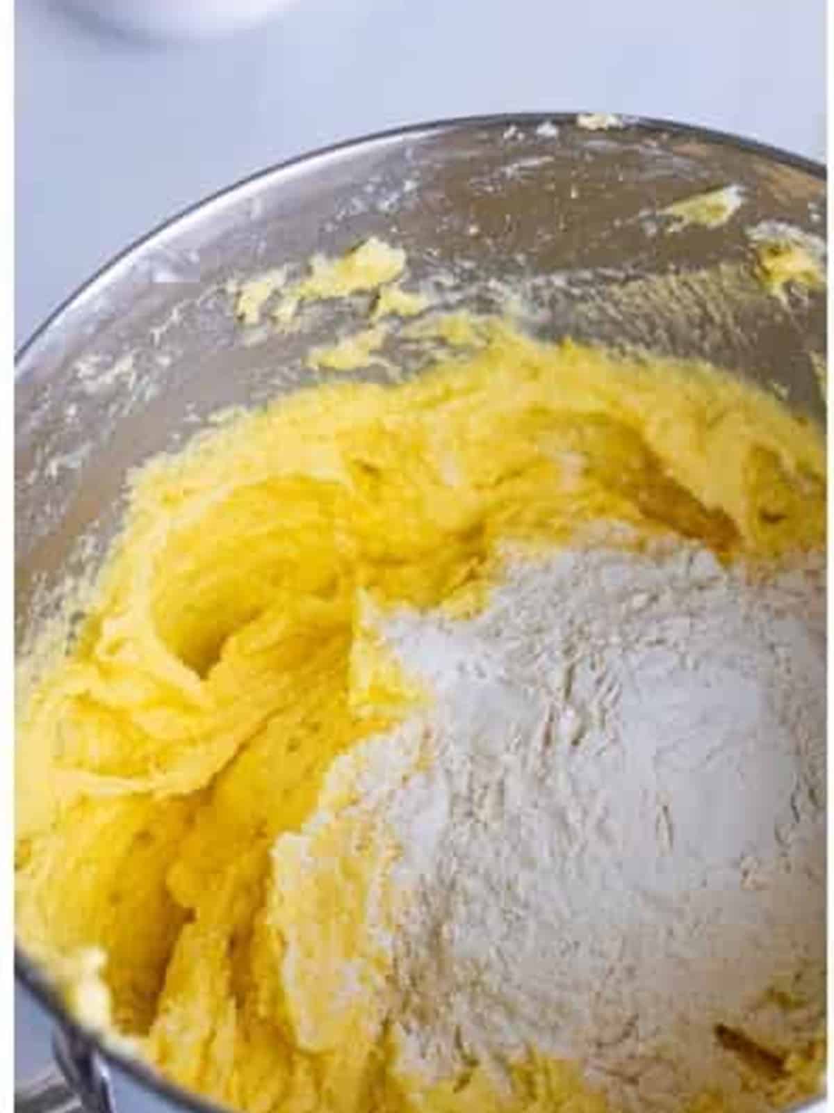 Mixing sour cream, fresh lemon juice, and lemon zest into the pound cake batter.