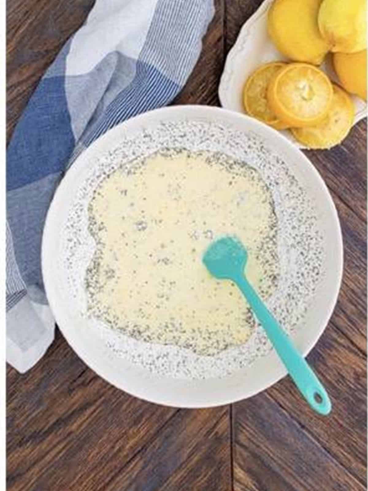 Wet ingredients poured into the dry ingredients to make lemon poppy seed pancake batter.
