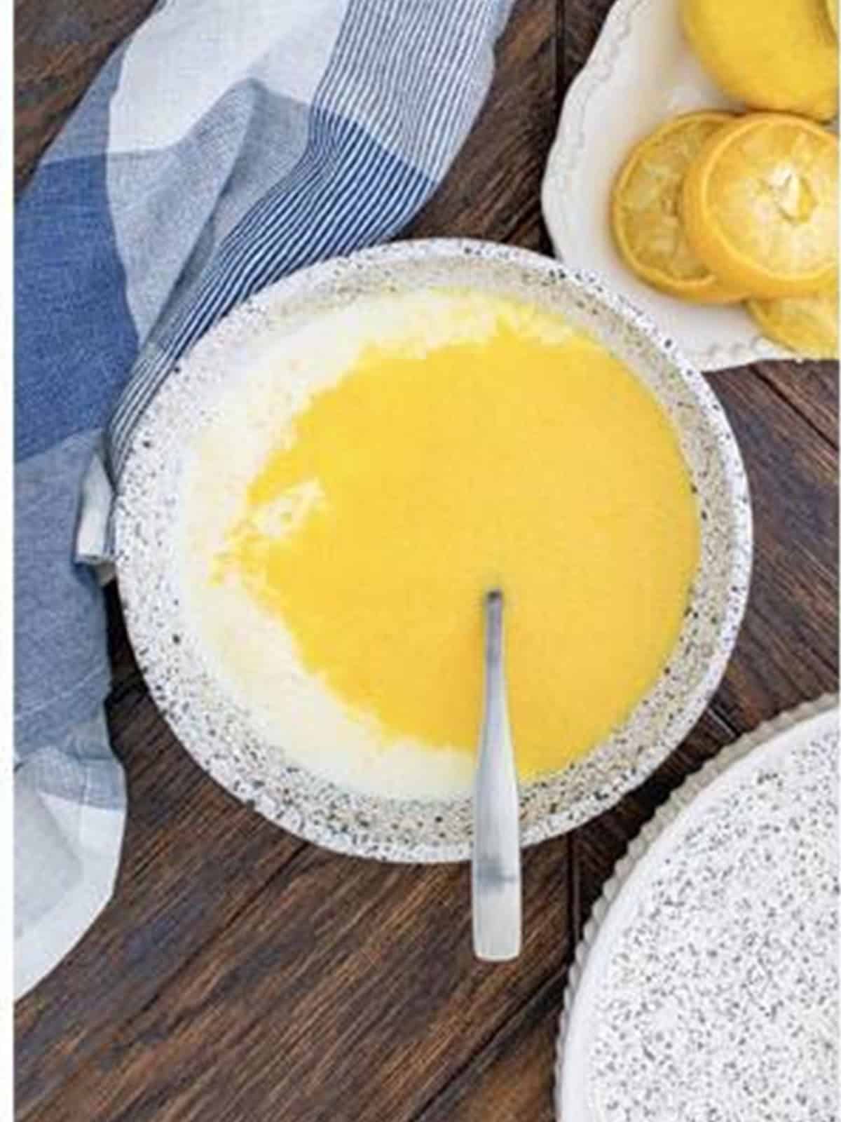 Lemon glaze made from powdered sugar, lemon juice, and vanilla whisked in a bowl.
