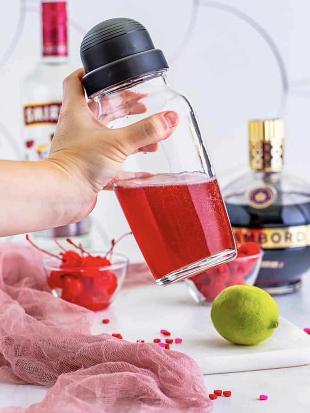 Chambord, cherry vodka, simple syrup, and lime juice shaken in a cocktail shaker.